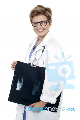 Female Doctor Holding X-ray Report Stock Photo