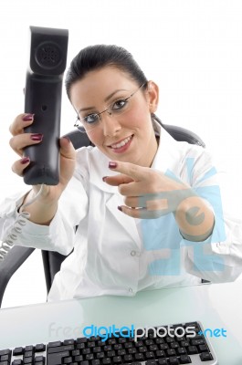 Female Doctor Pointing Phone Stock Photo