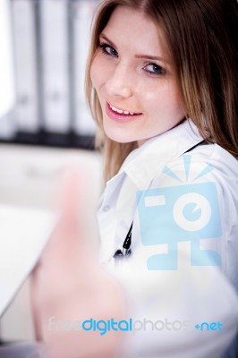 Female Doctor Showing Thumbs Up Sign Stock Photo