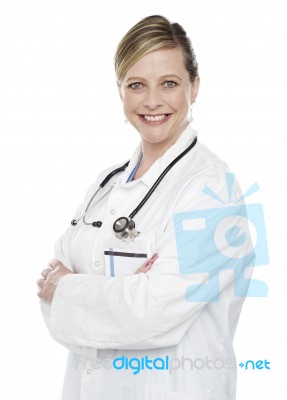 Female Doctor With Arms Crossed Stock Photo