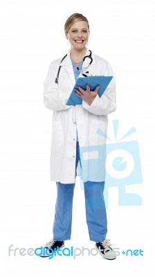 Female Doctor Writing Clipboard Stock Photo