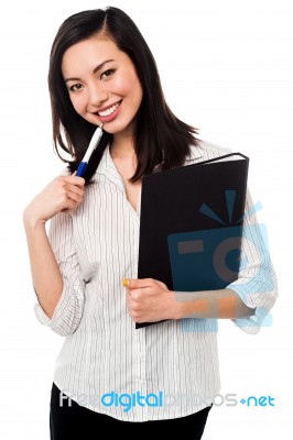 Female Employee Holding Office Files Stock Photo