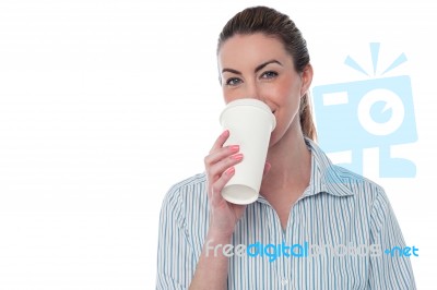 Female Employer Enjoying Beverage Stock Photo