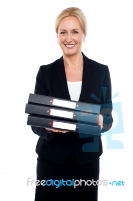 Female Executive Carrying Business Files Stock Photo