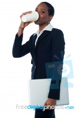 Female Executive Enjoying Cold Coffee Stock Photo