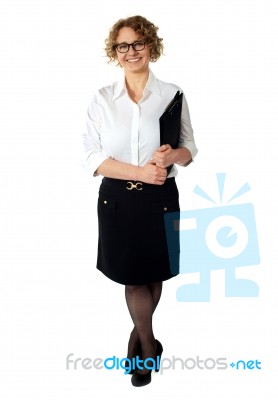 Female Executive Holding Clipboard. Isolated Stock Photo