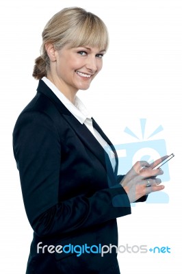 Female Executive Operating Touch Screen Cellphone Stock Photo