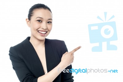 Female Executive Pointing At Something Stock Photo