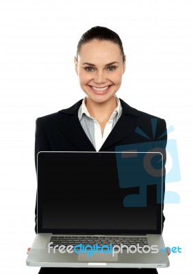 Female Executive Presenting Brand New Laptop Stock Photo