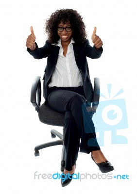 Female Executive Shows Thumb Up Stock Photo