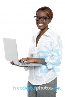 Female Executive Typing On Laptop Stock Photo