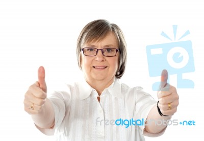 Female Gesturing Double Thumbs Up Stock Photo