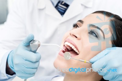 Female Getting Her Teeth Examined Stock Photo