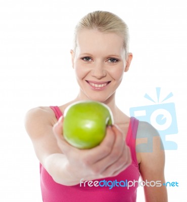 Female Giving Green Apple Stock Photo