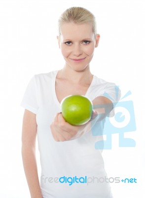 Female Giving Green Apple Stock Photo