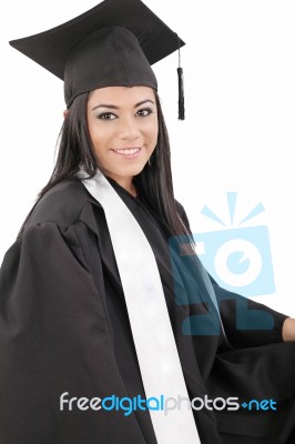 Female Graduate Wearing A Gown And Mortarboard Stock Photo