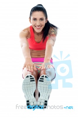 Female Gym Instructor Stretching Her Body Stock Photo