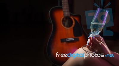 Female Hand Holding A Glass Of Champagne Stock Photo