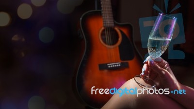 Female Hand Holding A Glass Of Champagne Stock Photo