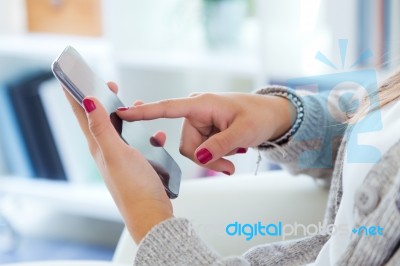 Female Hands Holding Smartphone At Home Stock Photo