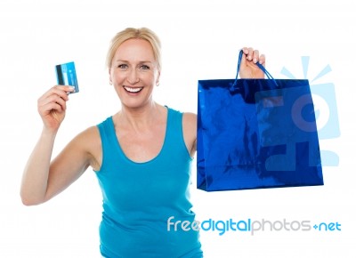 Female Holding Bag And Credit Card Stock Photo