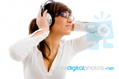 Female Listening Music Stock Photo