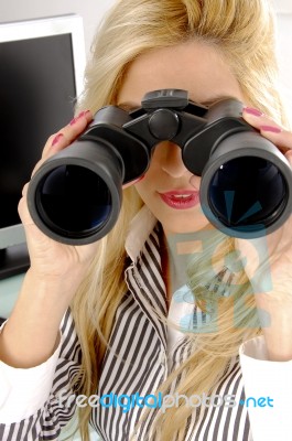 Female Looking Through Binocular Stock Photo