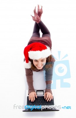 Female Lying Floor With Laptop Stock Photo