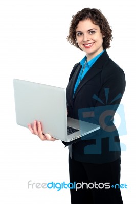 Female Manager Working On Laptop Stock Photo