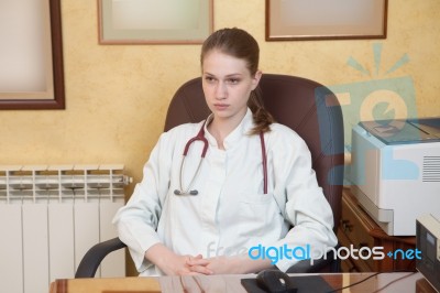 Female Medical Doctor In A Hospital Office Stock Photo