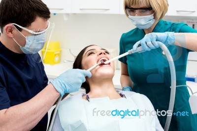 Female Patient At Dental Clinic For Treatment Stock Photo