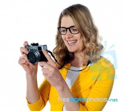 Female Photographer With A Camera Stock Photo