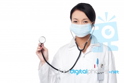 Female Physician Posing With Stethoscope Stock Photo