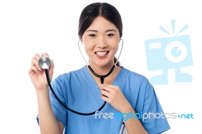 Female Physician Posing With Stethoscope Stock Photo