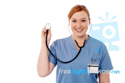 Female Physician Posing With Stethoscope Stock Photo