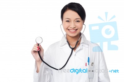 Female Physician Posing With Stethoscope Stock Photo