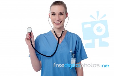 Female Physician Posing With Stethoscope Stock Photo