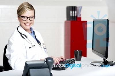 Female Physician Using Computer Stock Photo