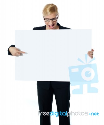 Female Pointing At White Billboard Stock Photo