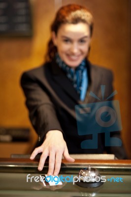 Female Receptionist Touching Card Stock Photo