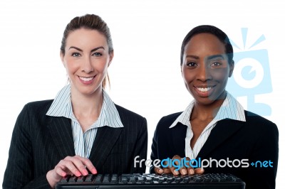 Female Secretaries Typing In Keyboard Stock Photo