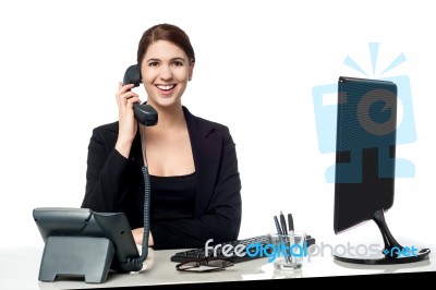 Female Secretary Answering Phone Call Stock Photo