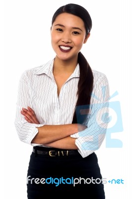 Female Secretary Posing With Arms Crossed Stock Photo