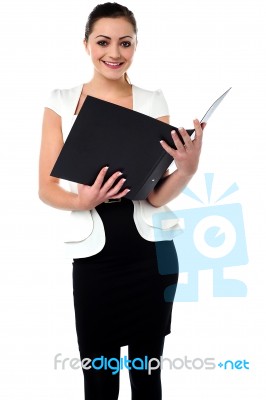 Female Secretary Reviewing Companys File Stock Photo