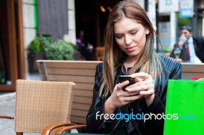 Female Shopper Texting Stock Photo