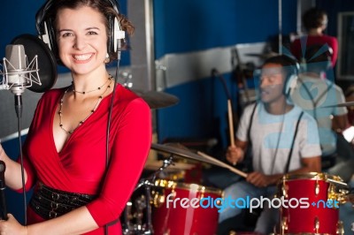 Female Singer Recording A Track In Studio Stock Photo