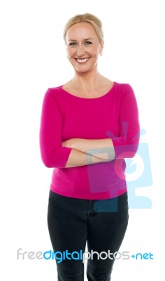 Female Standing With Arms Crossed Stock Photo