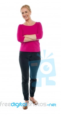 Female Standing With Arms Crossed Stock Photo