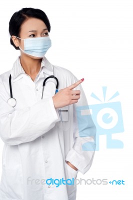 Female Surgeon Pointing Out Something Stock Photo