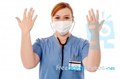 Female Surgeon Raising Her Arms Stock Photo